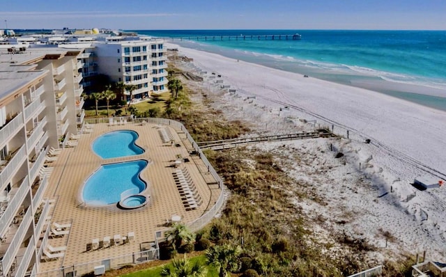 birds eye view of property featuring a water view and a view of the beach