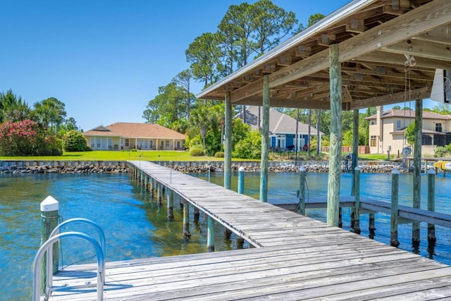 dock area featuring a residential view and a water view