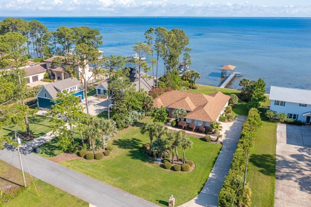 birds eye view of property featuring a water view and a residential view