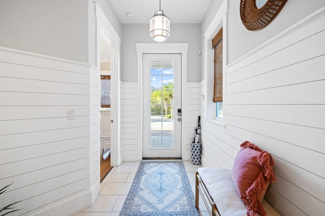 doorway to outside featuring light tile patterned floors