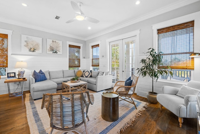 living room with ornamental molding, dark hardwood / wood-style floors, and french doors