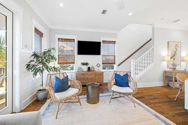 sitting room with crown molding and dark hardwood / wood-style floors