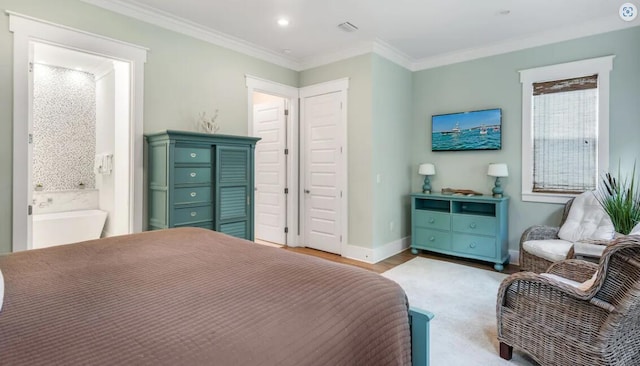 bedroom with crown molding, ensuite bathroom, and light wood-type flooring