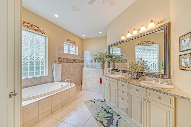 bathroom with tile patterned flooring, plus walk in shower, vanity, and ceiling fan