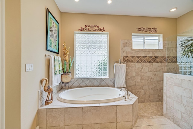 bathroom with tile patterned flooring and plus walk in shower