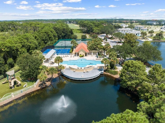 birds eye view of property with a water view