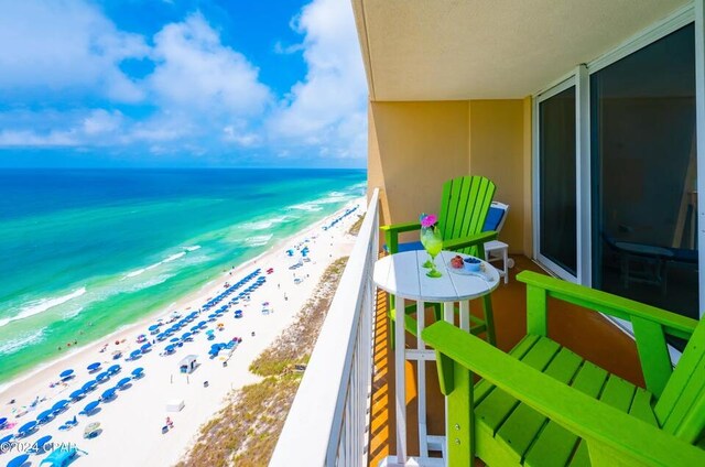 balcony with a beach view and a water view