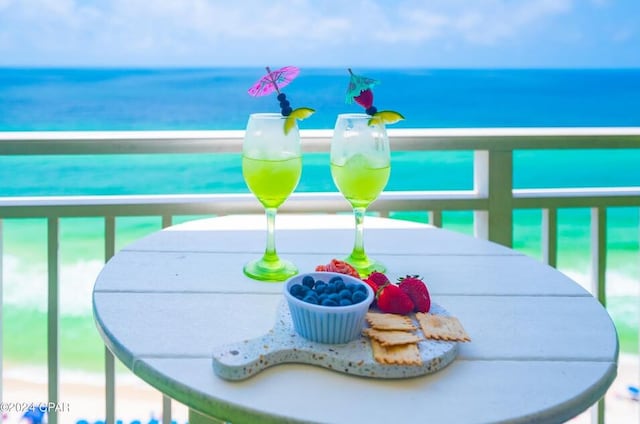 balcony featuring a water view