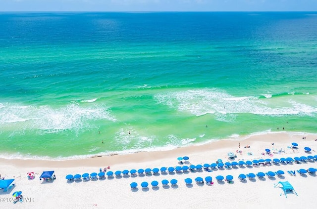 birds eye view of property featuring a view of the beach and a water view