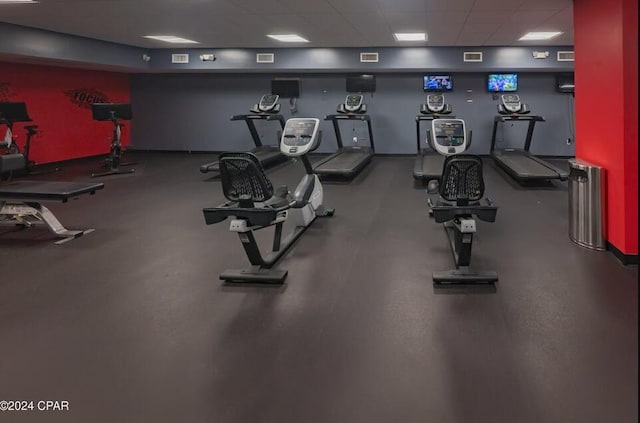 exercise room featuring a drop ceiling