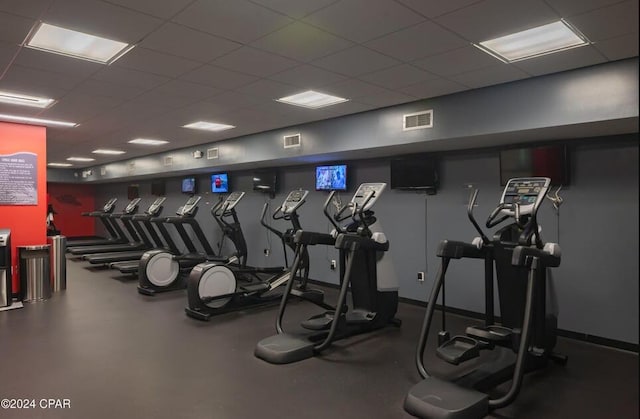 workout area featuring a paneled ceiling