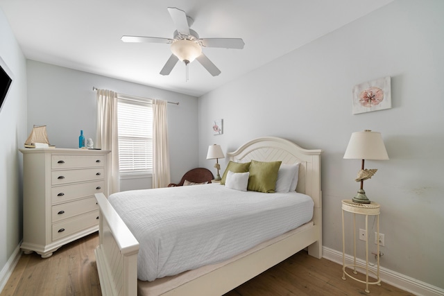 bedroom featuring hardwood / wood-style flooring and ceiling fan