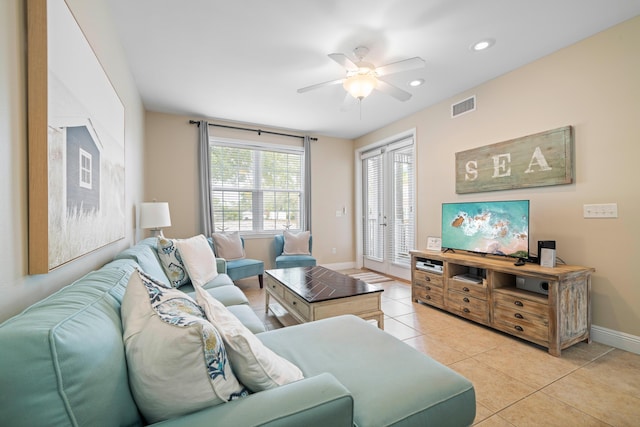 tiled living room with ceiling fan