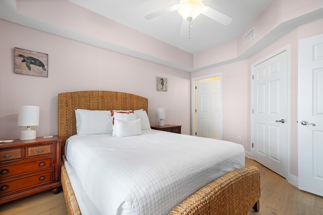 bedroom with ceiling fan and light hardwood / wood-style floors