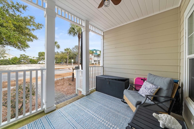 sunroom / solarium with ceiling fan and wooden ceiling