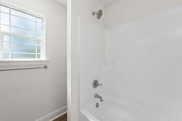 bathroom with shower / bathtub combination