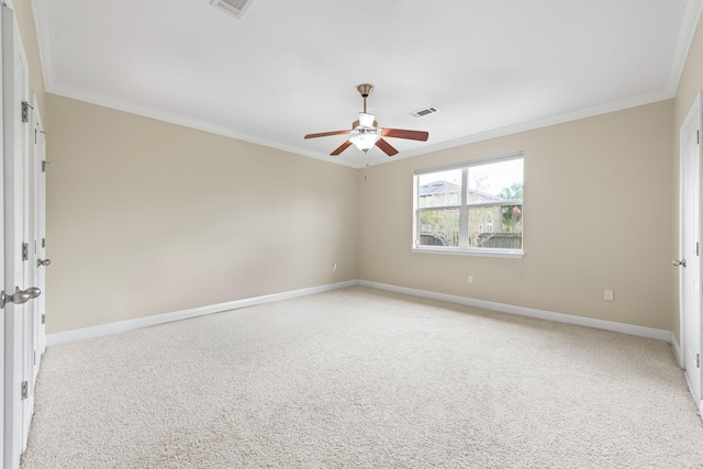 carpeted empty room with ornamental molding and ceiling fan