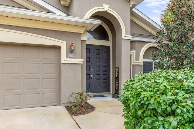 doorway to property featuring a garage