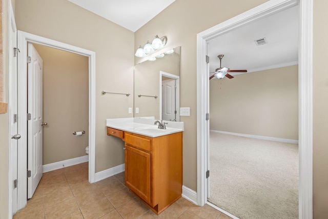 bathroom featuring vanity, tile patterned floors, toilet, and ceiling fan