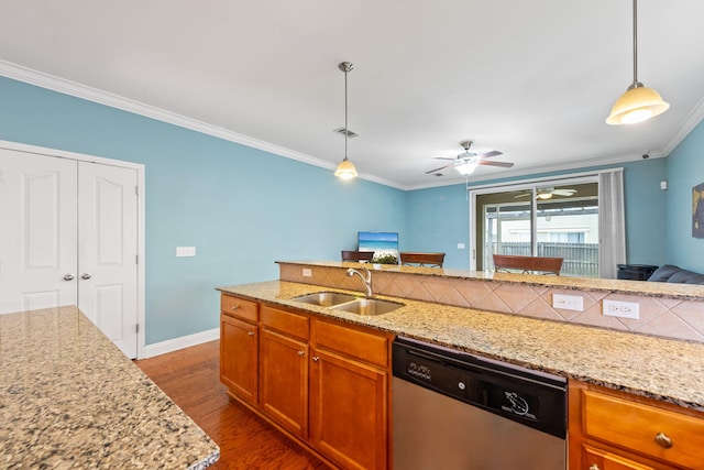 kitchen with pendant lighting, sink, crown molding, dishwasher, and dark hardwood / wood-style floors