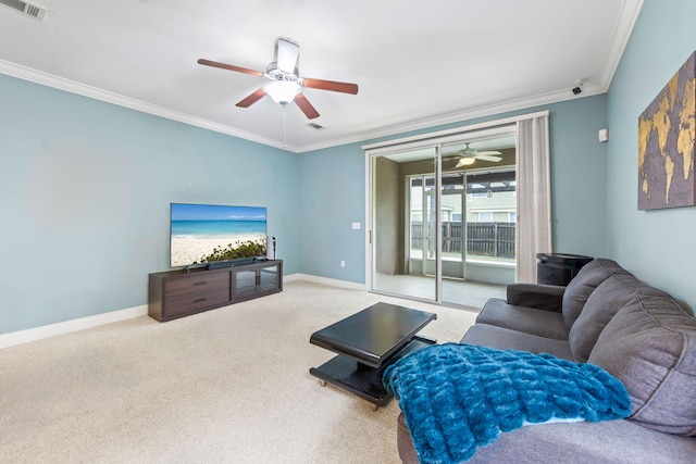 living room featuring crown molding, ceiling fan, and carpet