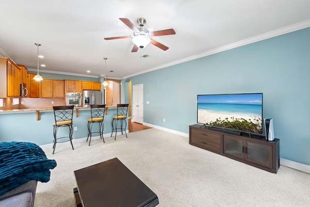 living room with crown molding, light carpet, and ceiling fan