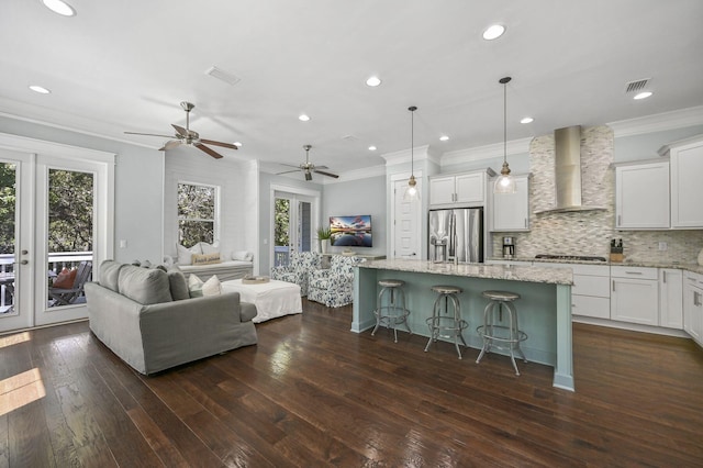 interior space with ornamental molding, dark hardwood / wood-style flooring, and french doors