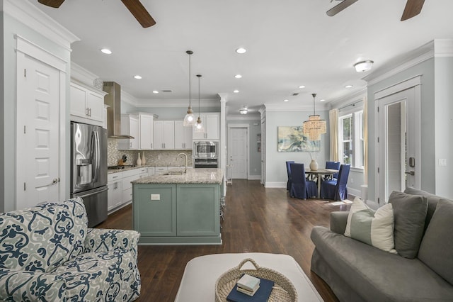 living room featuring crown molding, ceiling fan, dark hardwood / wood-style floors, and sink