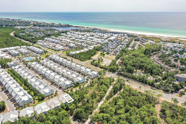 bird's eye view featuring a water view and a view of the beach