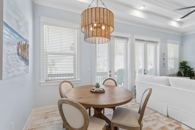 dining room featuring ceiling fan with notable chandelier and a wealth of natural light