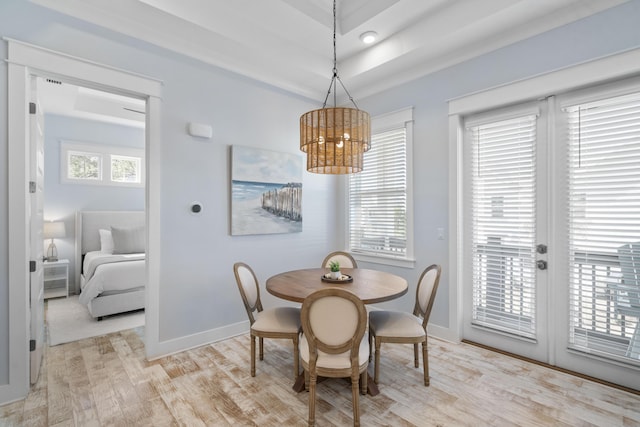 dining area featuring plenty of natural light and light hardwood / wood-style flooring