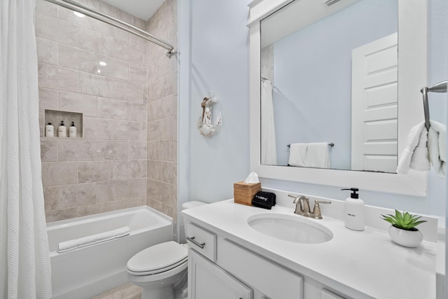 full bathroom with shower / bathtub combination with curtain, vanity, and toilet