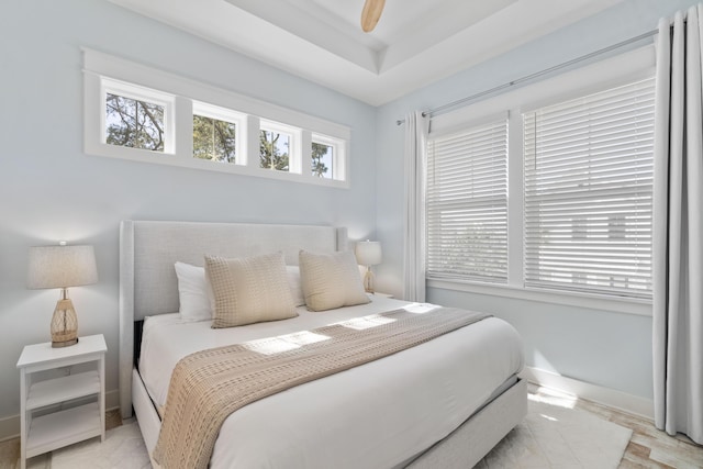 bedroom featuring light hardwood / wood-style flooring and ceiling fan