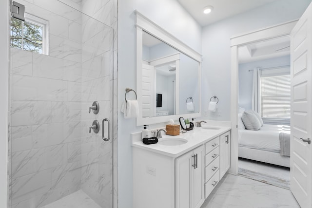 bathroom with walk in shower and vanity