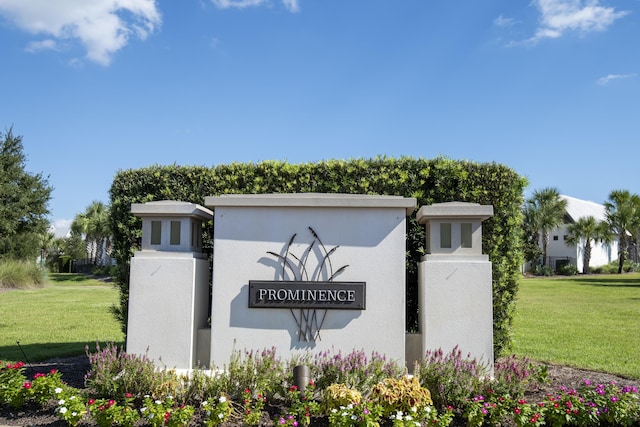 community / neighborhood sign featuring a lawn