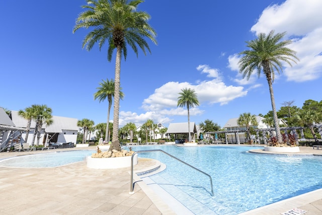 view of swimming pool with a patio