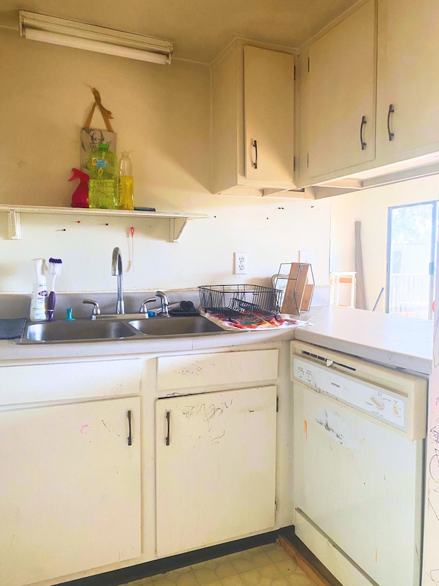 308 Miracle Strip Pkwy Unit 4C, Fort Walton Beach, FL 32548 - kitchen with white dishwasher, a sink, light countertops, and open shelves
