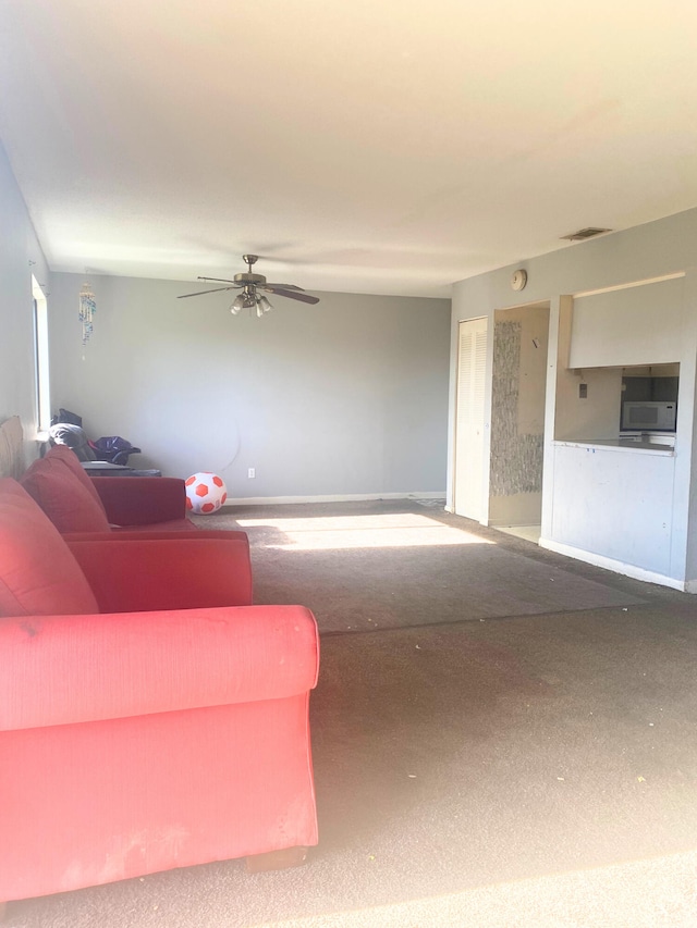 308 Miracle Strip Pkwy Unit 4C, Fort Walton Beach, FL 32548 - living area with carpet and a ceiling fan