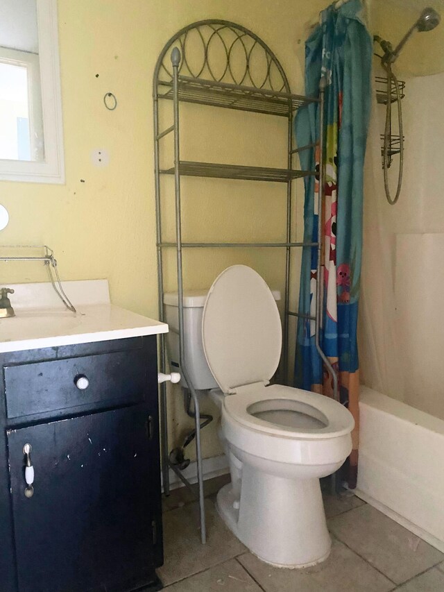 308 Miracle Strip Pkwy Unit 4C, Fort Walton Beach, FL 32548 - bathroom with tile patterned floors, vanity, toilet, and shower / bathtub combination with curtain