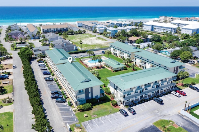 drone / aerial view with a beach view and a water view