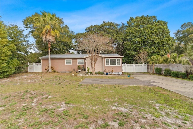 ranch-style home featuring a front yard