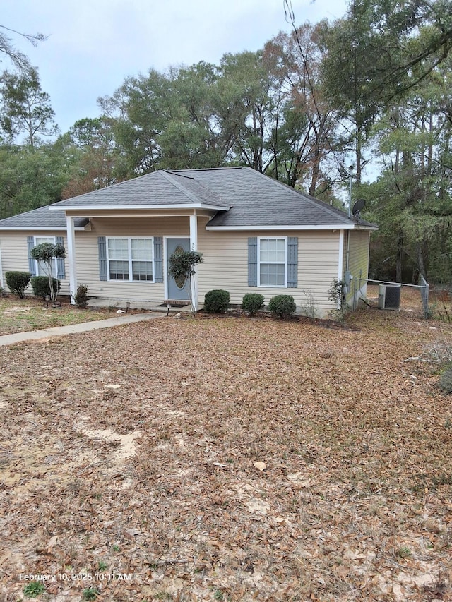 ranch-style home featuring central air condition unit