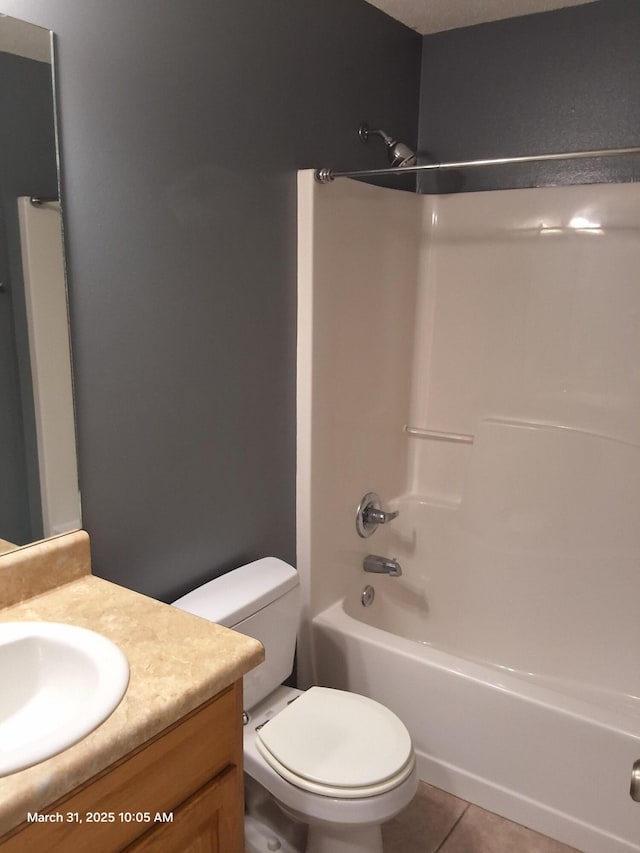 full bath with shower / tub combination, toilet, tile patterned floors, and vanity