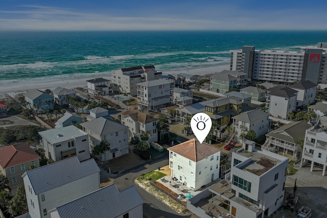 aerial view with a water view and a view of the beach