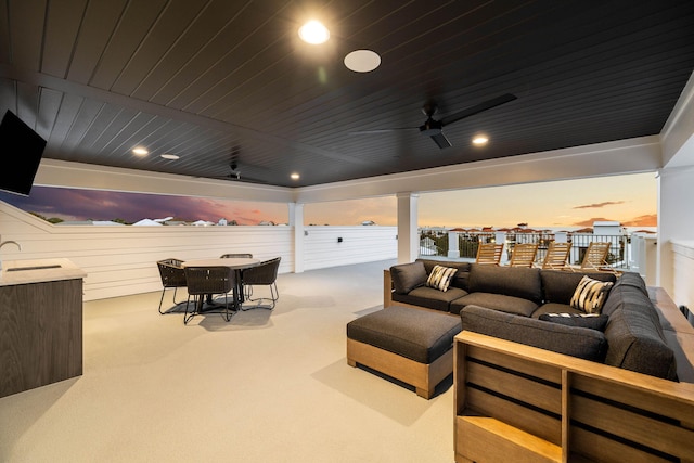 interior space featuring sink, wood ceiling, and ceiling fan