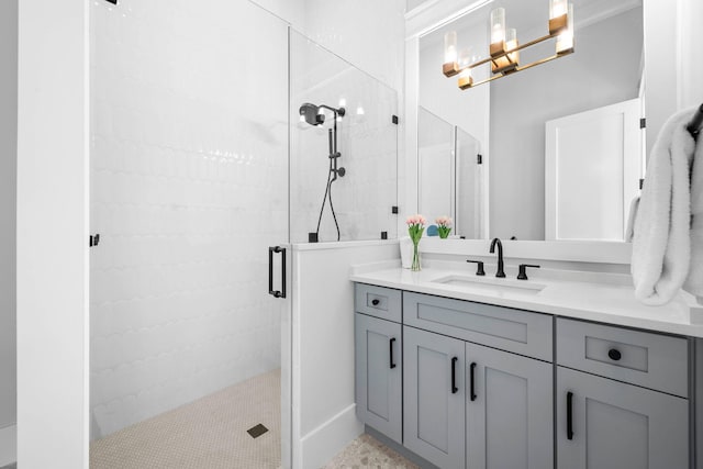 bathroom featuring vanity and an enclosed shower