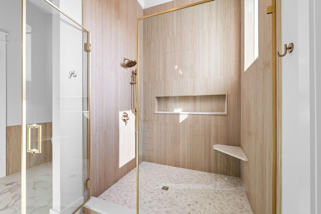 bathroom with a shower with shower door