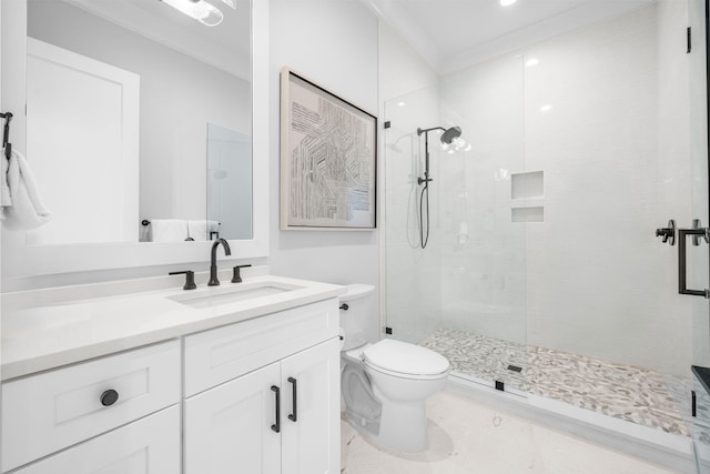 bathroom with vanity, an enclosed shower, ornamental molding, and toilet