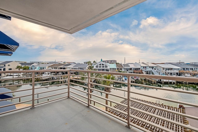 balcony featuring a water view