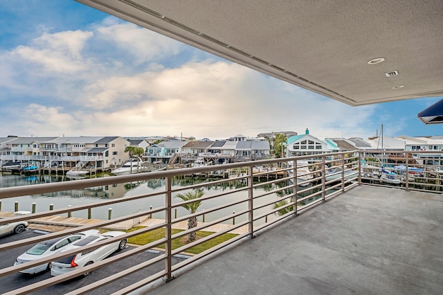 balcony featuring a water view